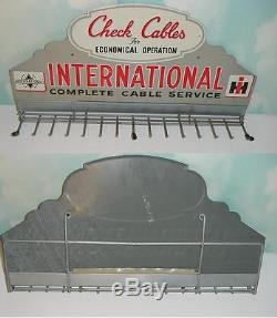 Vintage International Check Cables Tin Sign! Excellent Original Condition