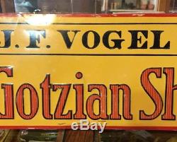 Vintage Sold by G. J. F. VOGEL Burt Iowa The Gotzian Shoe embosed Tin Sign 20 X 7